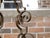 A French Art Deco period wrought iron eight-light chandelier from circa 1920 with large scrolling motifs. This exquisite...