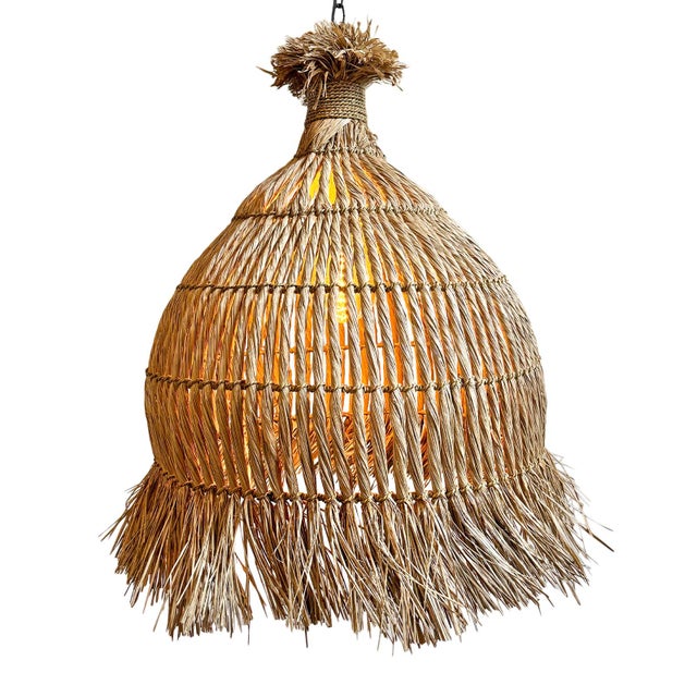 Beautiful hand woven seagrass pendant light with organic fringe edge. Large size makes this a wonderful natural statement...