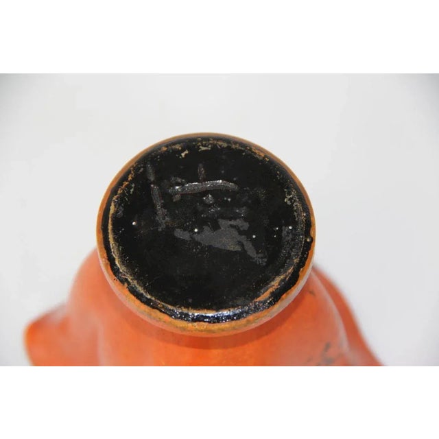 Kähler vase with orange uranium glaze. Good condition. Square shape. Blunt HAK stamp. This piece has an attribution mark,...