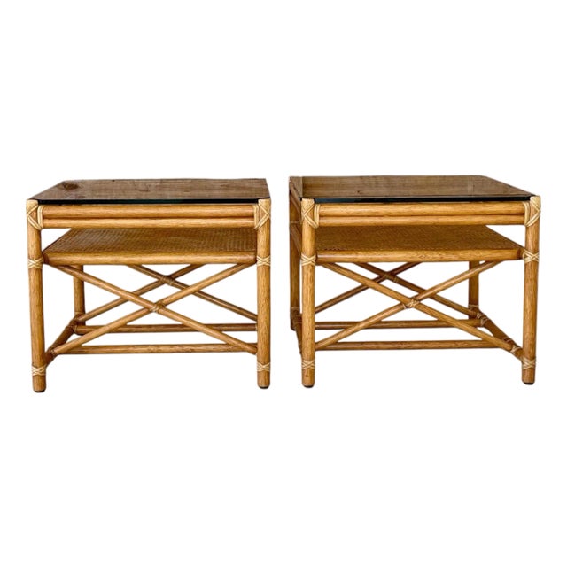 Pair of Vintage McGuire Organic Modern Rattan Side Tables With Cane Shelves and Glass Tops For Sale