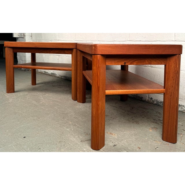 Elevate your living space with the timeless charm of these vintage teak end tables, expertly crafted by Randers of Denmark...