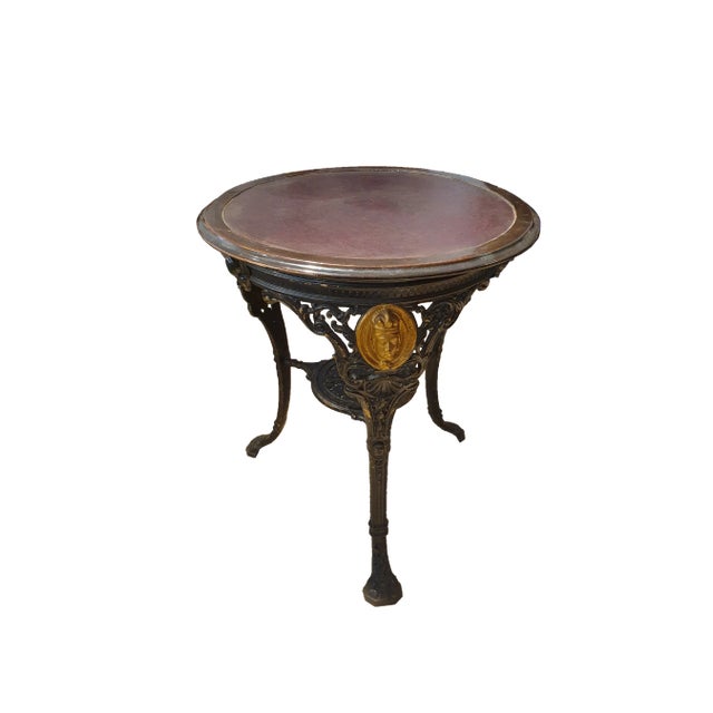 Round Cast Iron Structure Coffee Table With Golden Medallions, Wooden Top & Leather, in Very Good conditions. Designed...
