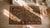 Pretty Sienna-Brown Background With Detail of Folk Art Styles in a Strie Pattern Antique American Hooked Rug For Sale - Image 12 of 13