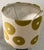 Decorative lampshade crafted from a natural linen textile printed with an oversized, rhythmic dot motif in a warm olive-...