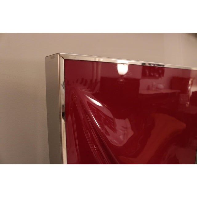A set of six modernist wall reliefs. Abstract red and white fibreglass forms mounted in chrome-plated frames.