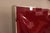 A set of six modernist wall reliefs. Abstract red and white fibreglass forms mounted in chrome-plated frames.