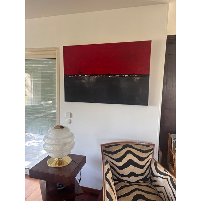 A striking work, poised between sky and abyss. This large abstract canvas by Marilyn Monnier (120 × 80 cm) captivates at...