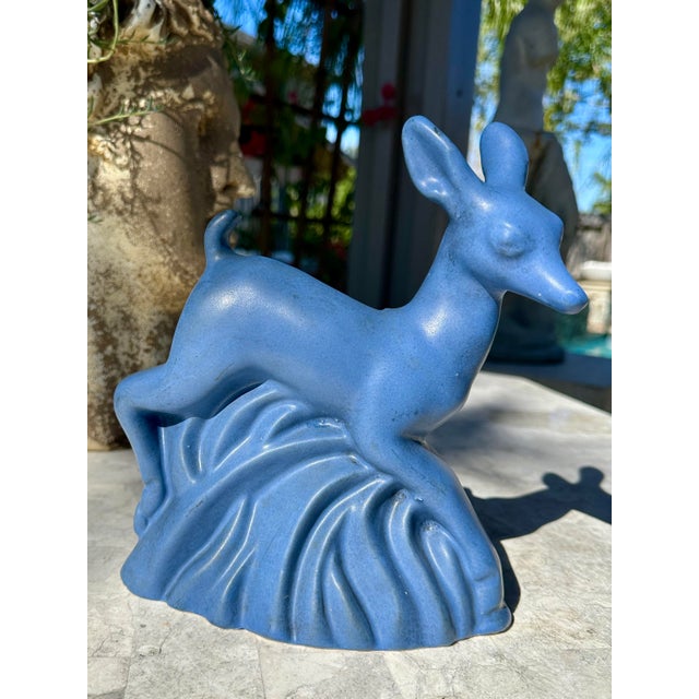 ⸻ Niloak Pottery Blue Deer Planter A sculptural ceramic planter by Niloak Pottery, featuring a stylized leaping deer in a...