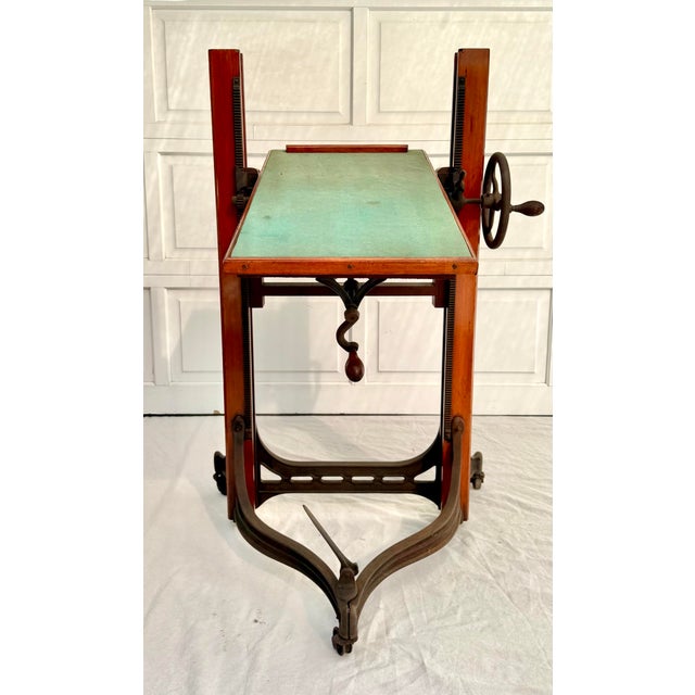 Here is an amazing late 19th c. - early 20th c. camera stand made from solid wood and cast iron. It is incredible and...