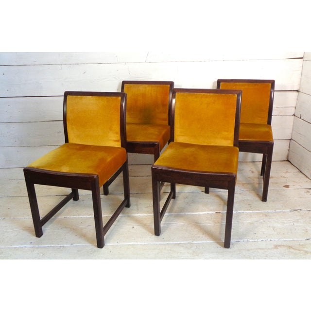 Four beautiful beech chairs upholstered in a precious gold-colored silk velvet. The structure is in the tone of a...