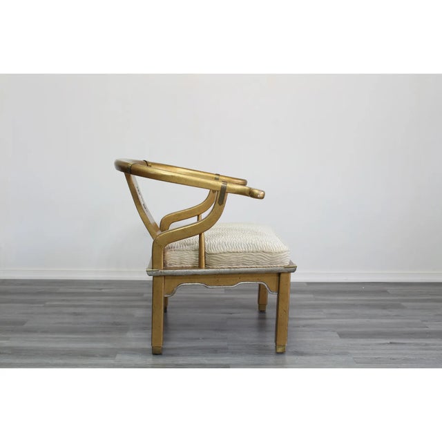 Pair of Mid century chinoiserie chair painted in gold and silver with gloss finish and accent brass brackets Dimensions;...