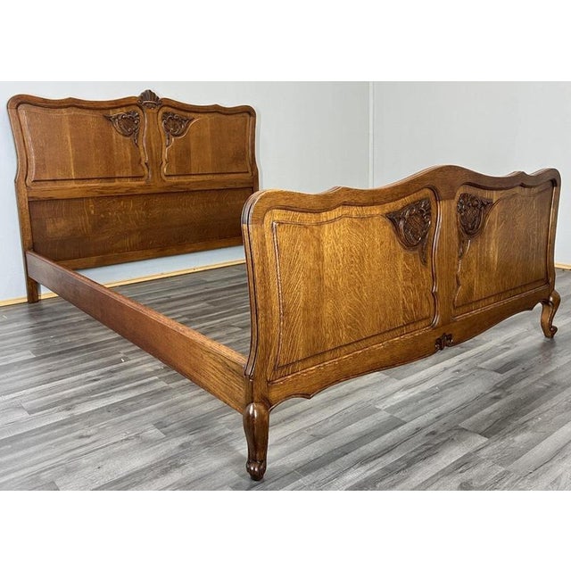 This Vintage French Louis double bed frame offers elegant French-inspired proportions with refined carved detailing, and...
