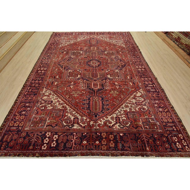 This authentic vintage traditional tribal Heriz rug is hand-knotted with fine wool and natural dyes. This nomadic oriental...
