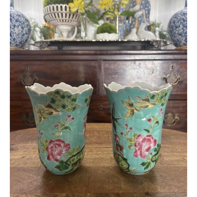 The most charming pair of famille rose enameled vases with a lovely scalloped upper border. Beautifully-enameled with rich...