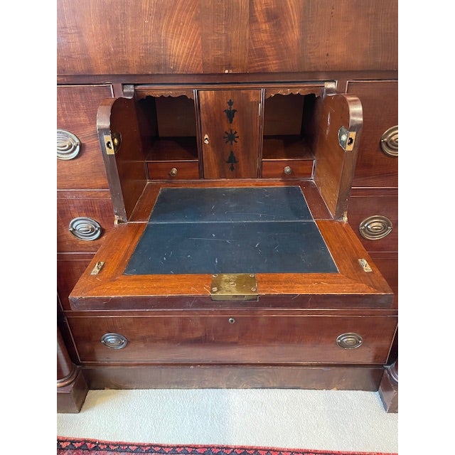 Unusual and beautiful 19th century English butler's chest. Flanked by Empire-style columns. Four long drawers, one hidden...