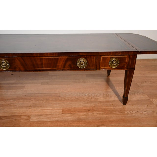 We are pleased to offer this beautiful English Regency coffee table by Weiman Furniture, from the 1930s. This table is...