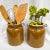 Imported from France. Antique glazed crocks with attached metal carriers. Originally created for food storage. They are...