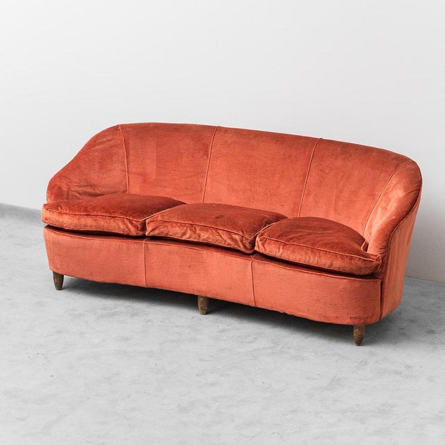 3 seater sofa. Orange/red velvet upholstery, wooden structure and feet. Good condition. There are signs of aging, as shown...