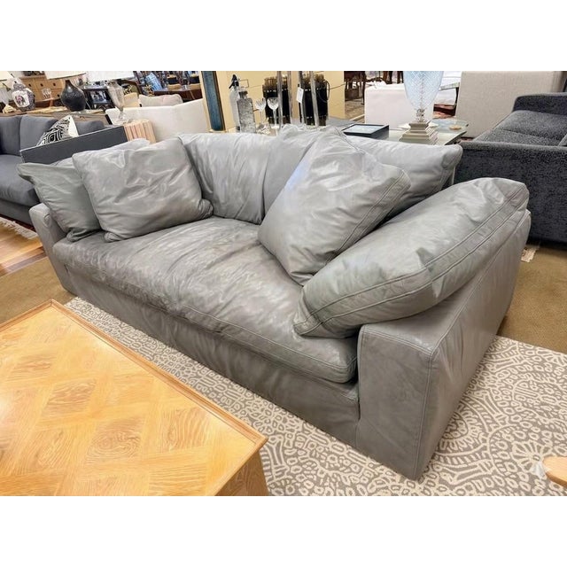 Restoration Hardware leather Cloud sofa in a supple, smoky gray leather with the deeply relaxed, sink-in comfort. Its...
