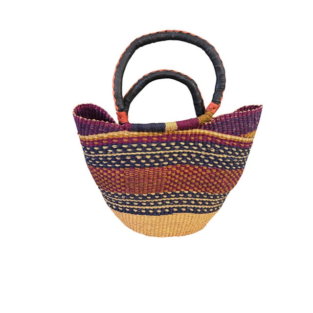 This African Bolga Basket from the Bolgatanga region of Ghana, inspired by Saint-Tropez French Riveria town, is of...