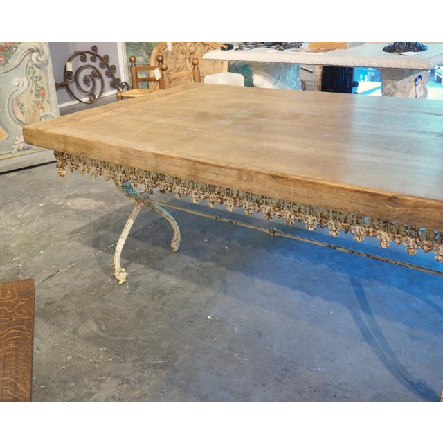 Dating to circa 1890, the long, painted table is from a small hotel in Aix-en-Provence, France, that was closing its...
