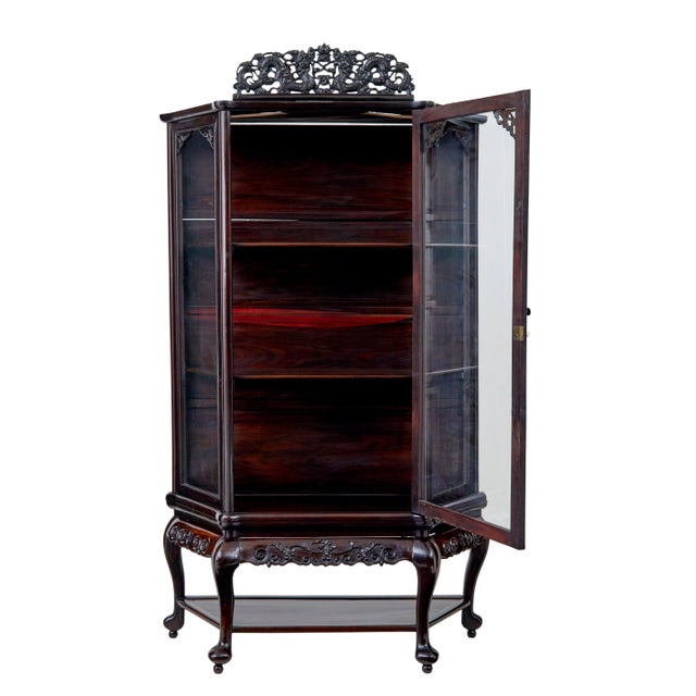 19th century chinese carved hardwood glazed display cabinet circa 1890 single large glazed door opens to 2 shelves, stands...