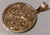 Handcrafted 18-karat gold coin pendant from around 1930. It weighs 12.7 grams and measures 2.7 cm. It is made of 18-karat...