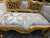 A beautiful 1980s French Louis XVI-style settee, crafted from solid beechwood with a hand-gilded gold finish and newly...