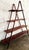 This rare dark-stained bamboo, rattan 4-tier A-frame cascade display étagère features slatted graduated shelves and...