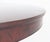 An impressive and substantial split-base dining table of circular form when closed, offering both elegance and versatility...
