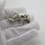 This vintage silver decorative object depicts a detailed elephant figurine miniature with tusks, crafted as a cabinet...