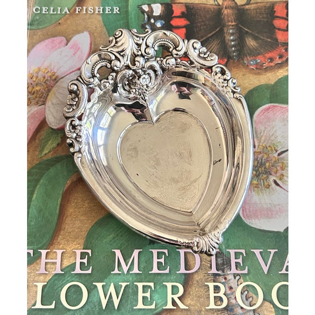 Vintage silverplate heart-shaped dish in the Baroque pattern by Wallace Silversmiths. Features elaborate floral and...