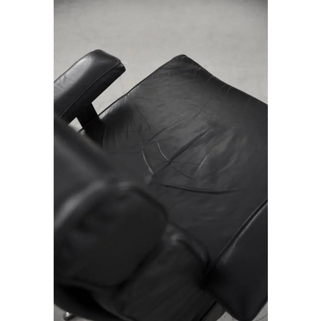 This office swivel armchair was manufactured in the Germany during the 1960s. The frame is made from metal. The chair is...