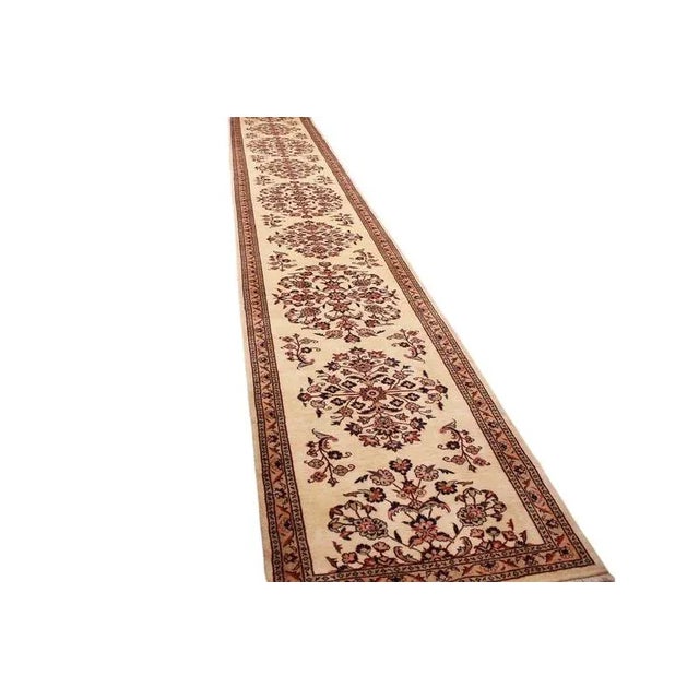 Traditional Middle Eastern rug Sarouk | Knot density: 300.000 knots/m² | Material: High-quality wool | Size: 637×95 cm |...
