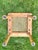This solid wood end table with a rattan-woven top looks like the “little sister” table to the larger coffee table that I...