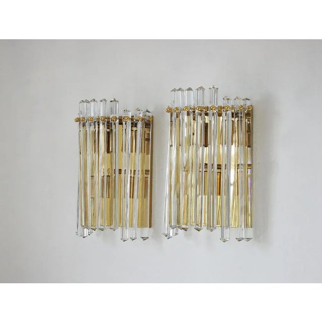 A pair of Italian Venini style wall sconces. The wall sconces stand out not only for their functionality, but also for...