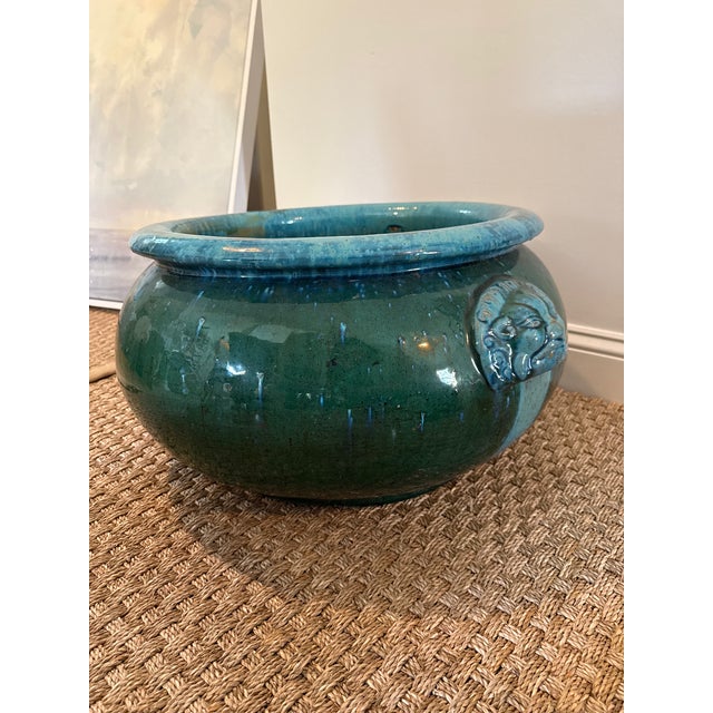 Exceptional oversized Chinese ceramic jardiniere featuring a dramatic low, rounded form finished in a rich turquoise and...