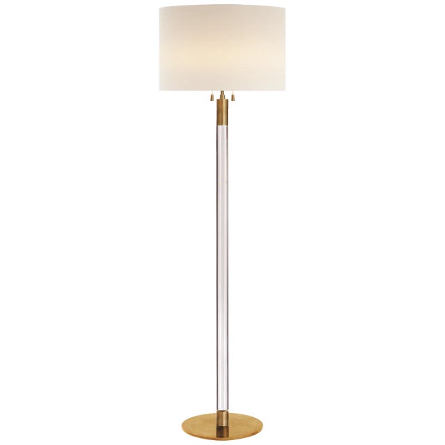 Riga Floor Lamp in Hand-Rubbed Antique Brass and Clear Glass with Linen Shade Designer: AERIN Height: 60.25" Shade Detail:...