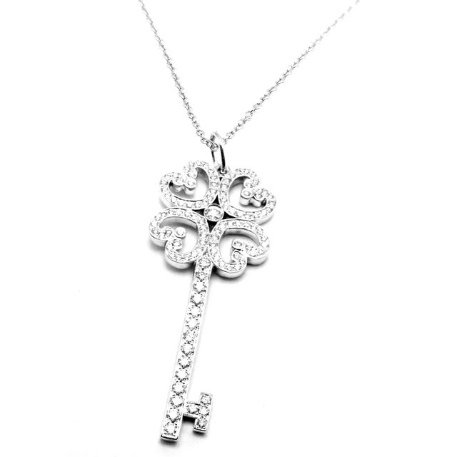 Contemporary Edit Late 20th Century Tiffany & Co. Platinum & White Gold Enchant Quatra Heart Key Pendant Necklace For Sale - Image 3 of 11