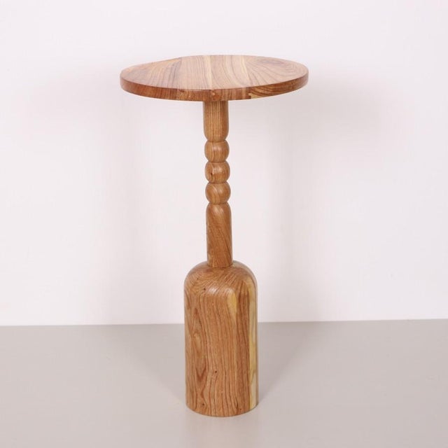 The Mina Teak Wood Side Table is a handcrafted masterpiece, made entirely from natural Teak wood. Each piece is unique,...