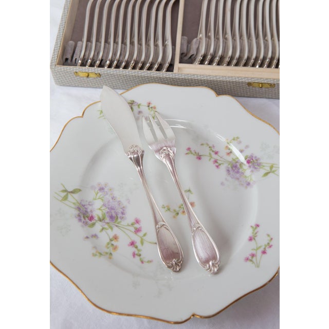 Silver-plated metal cutlery set, made by the silversmith Ercuis in the mid-20th century, featuring a beautiful Baroque...