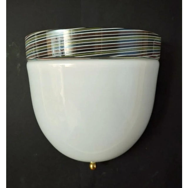 Vintage Italian wall light with a milky white Murano glass shade and clear glass rim infused with multicolored ribbing /...