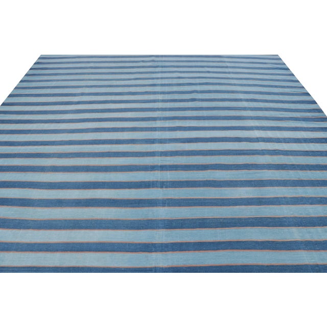 This 10x13 vintage rug is from a new collection of Dhurrie flat weaves in rare sizes and exceptional craftsmanship—an...