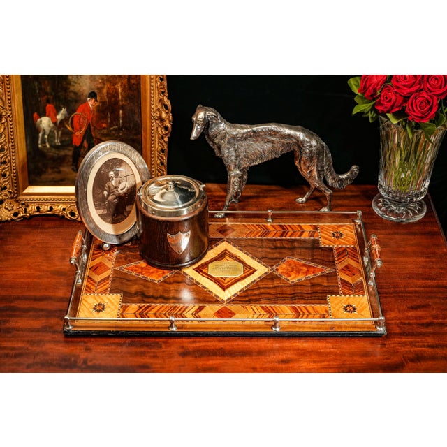 Step back in time with this remarkable antique marquetry inlaid tea tray, a truly unique piece with a rich history....