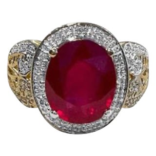 Oval 7.5 Carat Treated Ruby and 1 Carat Diamond 14 Karat Yellow Gold Ring For Sale