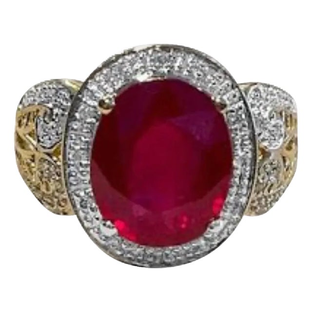 Oval 7.5 Carat Treated Ruby and 1 Carat Diamond 14 Karat Yellow Gold Ring For Sale
