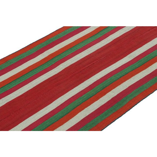 This vintage 4x9 Persian kilim is a mid-century tribal rug, handwoven in wool circa 1950-1960. This type of Kilim is...