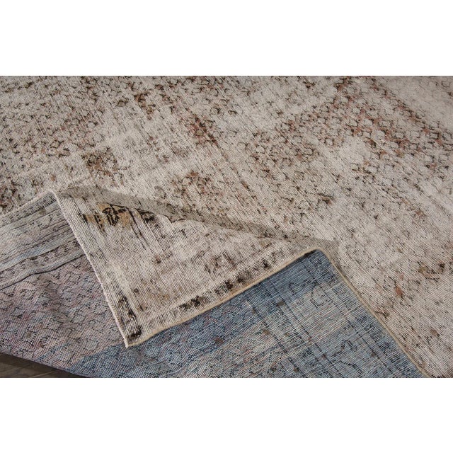 This beautiful vintage distressed Persian Tabriz hand-knotted design rug will make your floor look splendid. This...