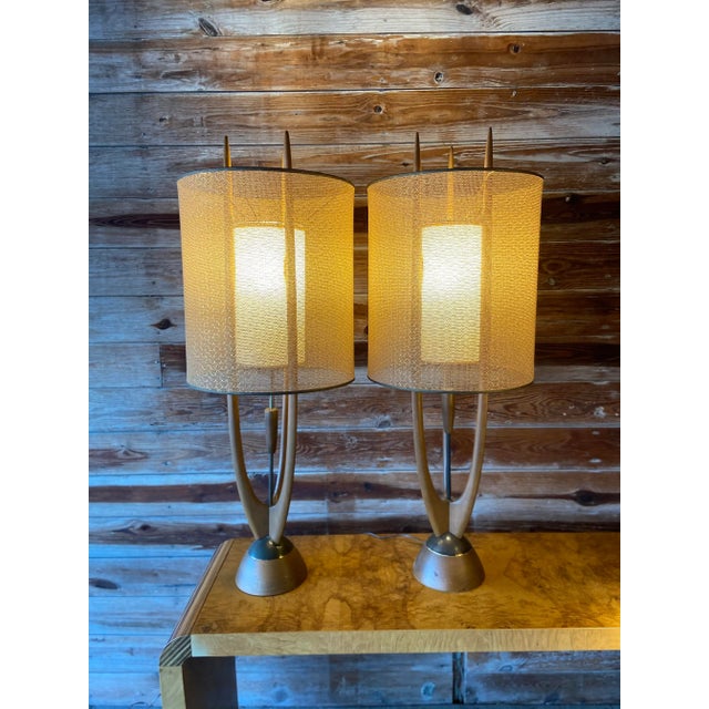 These babies are elegant and unique! Two matching 3-Point Modeline Attributed Cactus Table Lamps. The original switch sits...