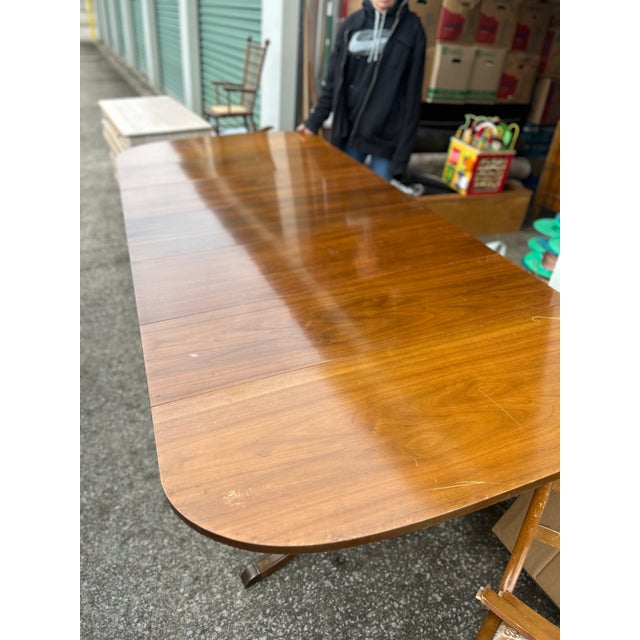 Beautiful dining room table. Has 3 leafs and 4 chairs. The set is in excellent condition. Beautiful finish and sturdy.